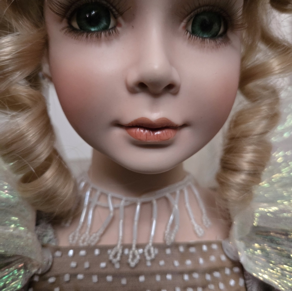 Elegant Porcelain Doll with Blonde Curls